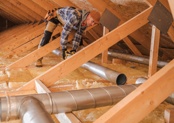 HVAC specialist installing a new duct