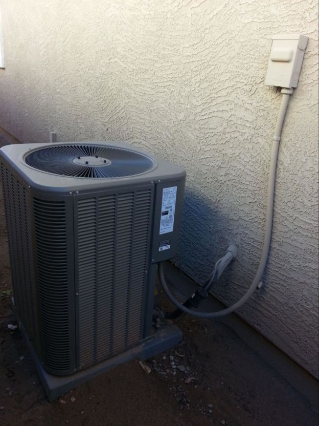 A full length view of an outdoor ground AC unit