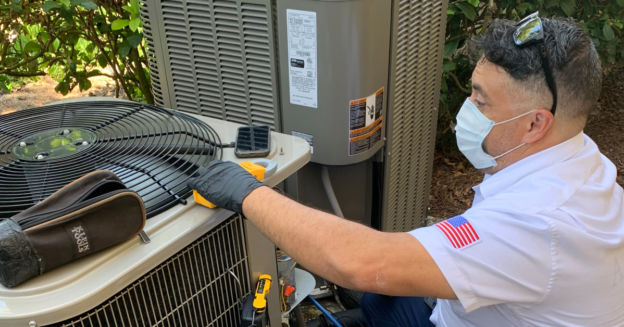 Advanced Air HVAC technician servicing an air conditioner